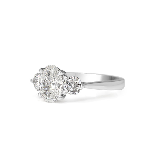 18ct White Gold Oval and Brilliant Cut Diamond 3 Stone Ring