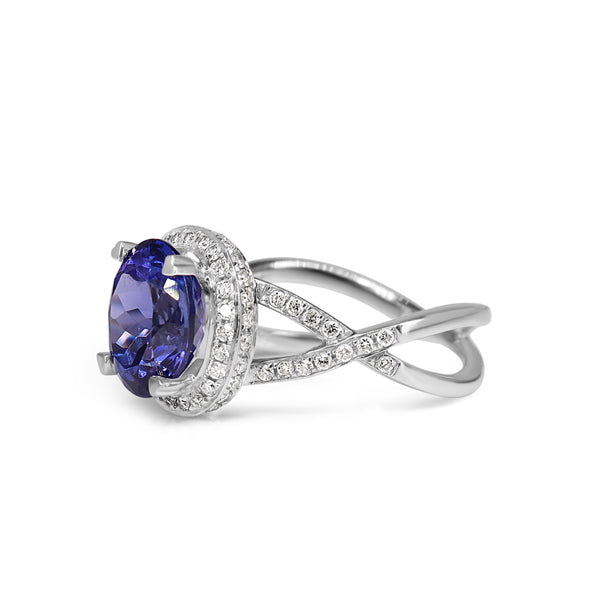 18ct White Gold Tanzanite and Diamond Halo and Twist Ring