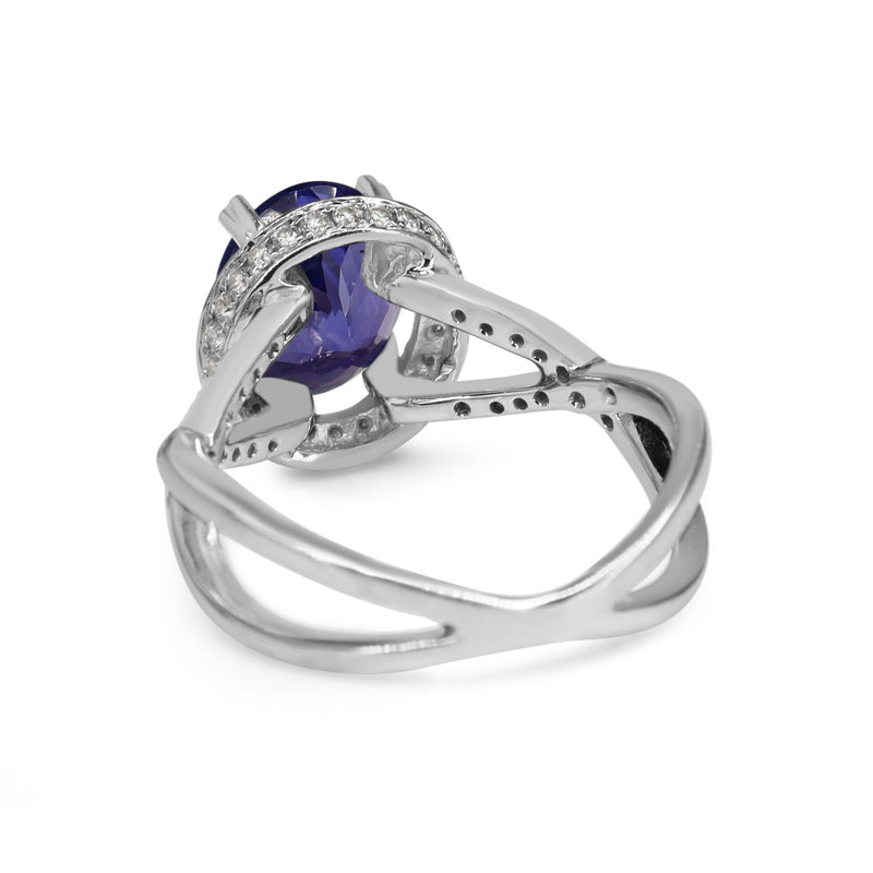 18ct White Gold Tanzanite and Diamond Halo and Twist Ring